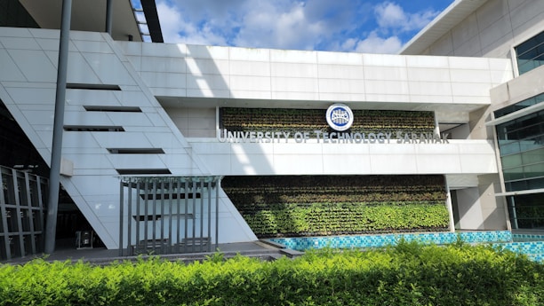 Front view of MTs NU Tegalpelem school building with green and black accents under a clear sky.