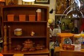 An elegant kitchen setup showcasing stylish storage containers and warm orange accents.
