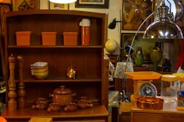 An elegant kitchen setup showcasing stylish storage containers and warm orange accents.