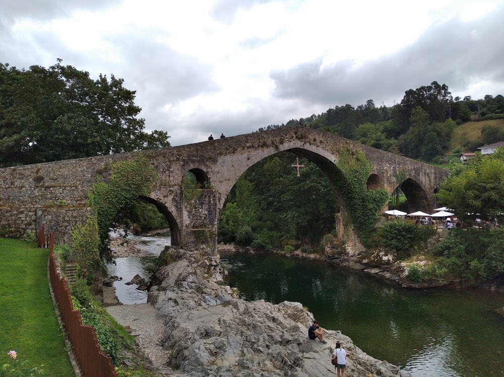 a stone bridge over a river