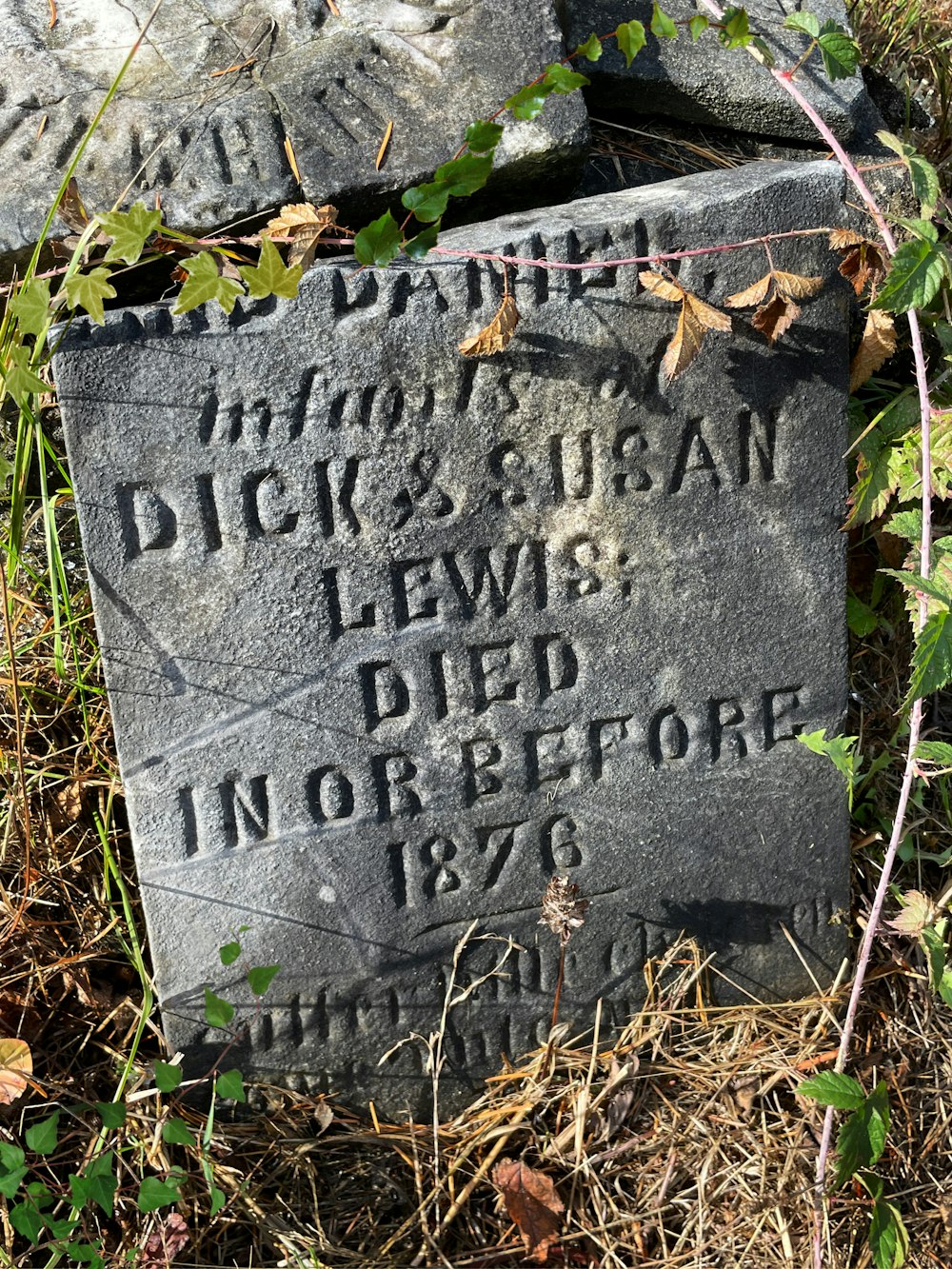 a tombstone with writing on it