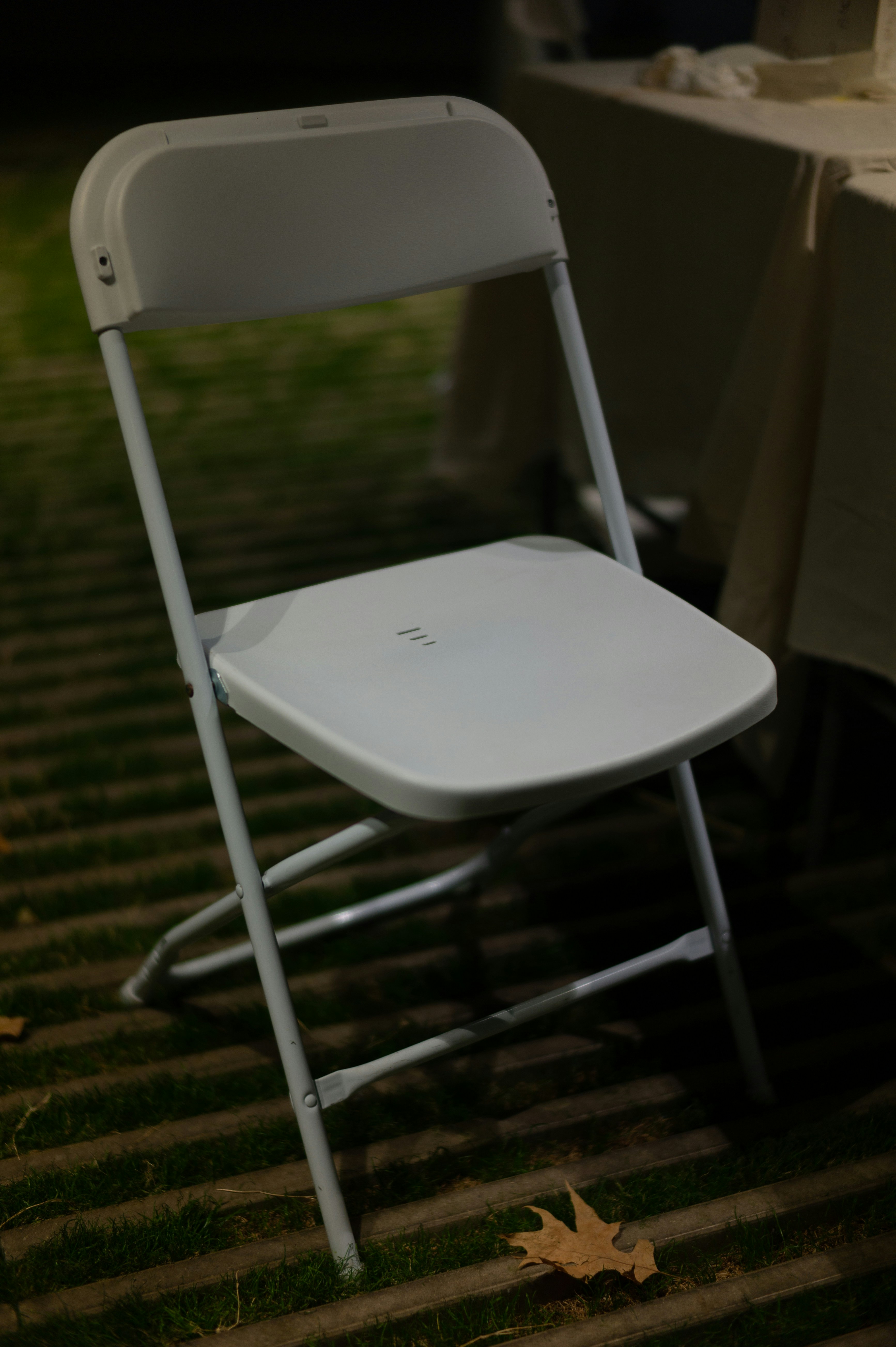 a white chair on a lawn