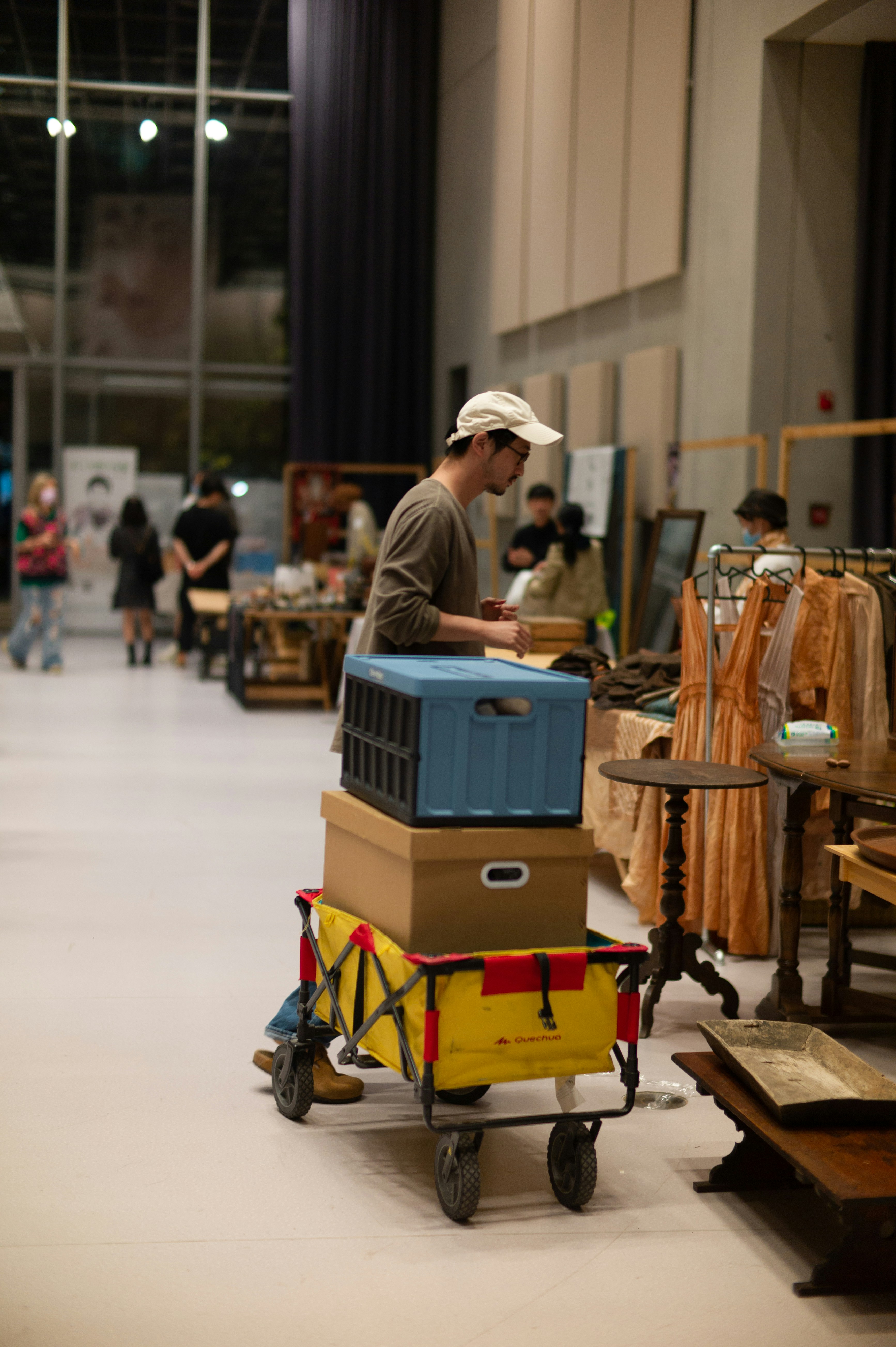 a person with a cart full of luggage