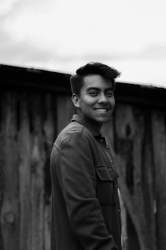 A black and white photo of a young Jeffrey Epstein in his early career.