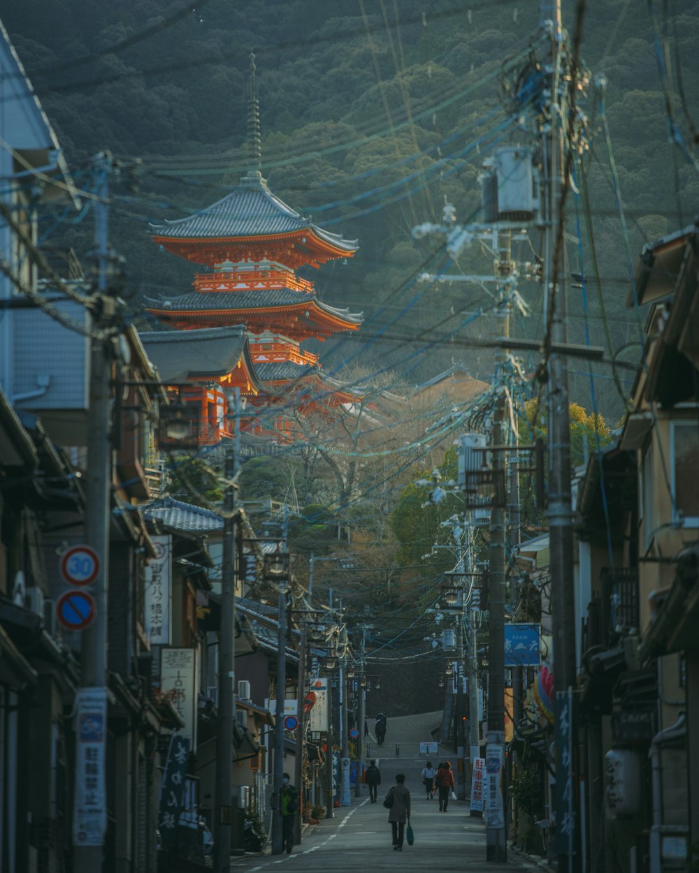 a street with buildings and people