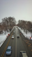 Winter maintenance crew working near the historic riverfront area of Hammond with snow gently falling.