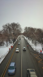 A team deicing a road to ensure safety.