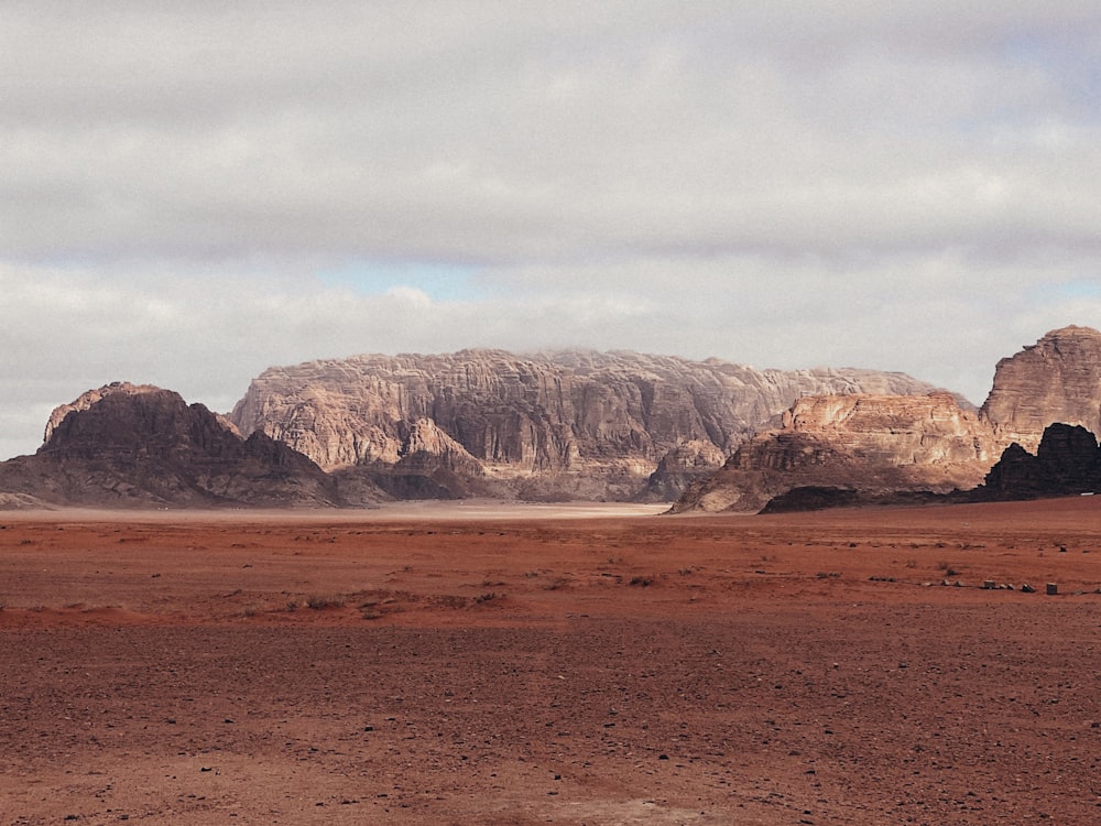 a desert landscape with rocky mountains