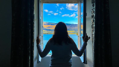 a person looking out a window