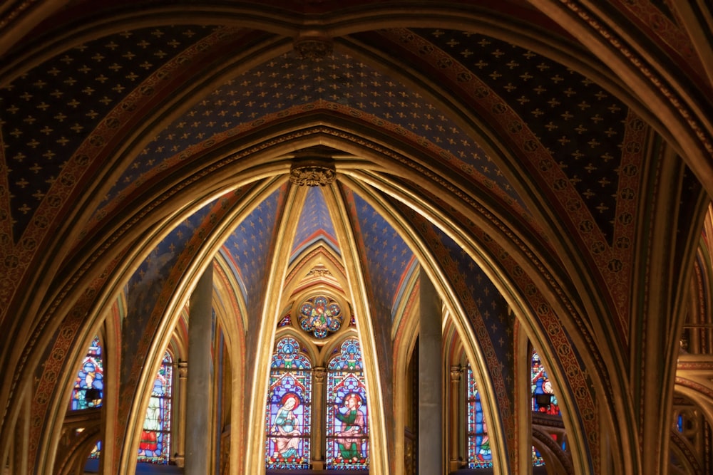 a large stained glass window with Sainte-Chapelle in the background