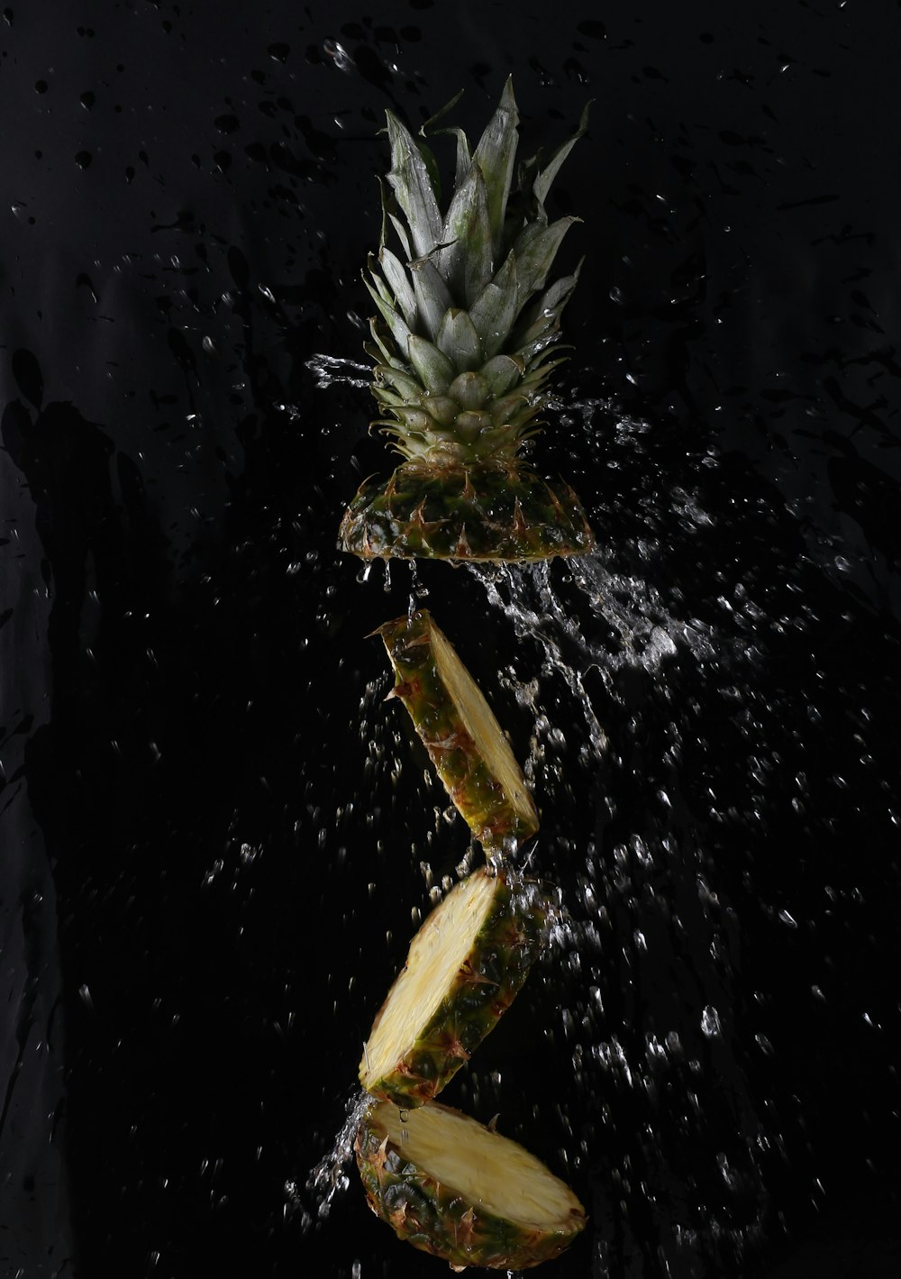 a pineapple on a black surface