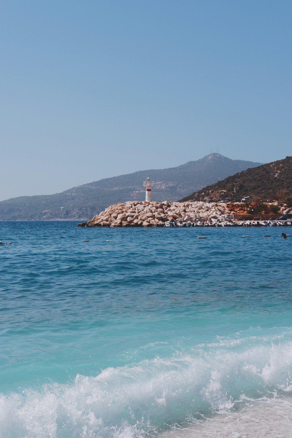 a lighthouse on a rocky island