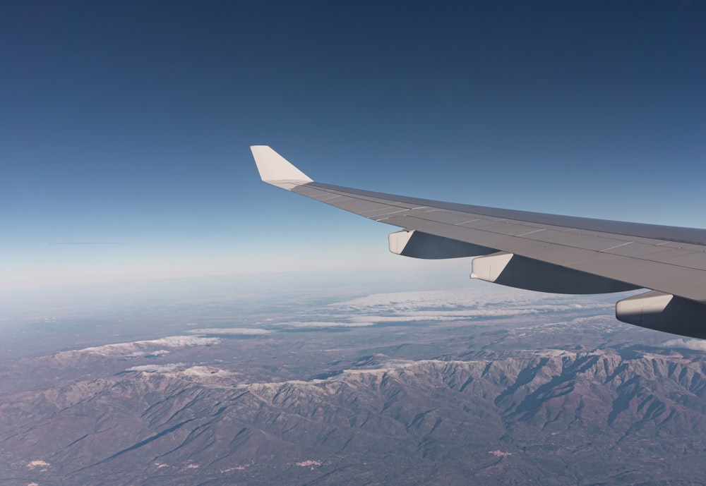 an airplane wing in the sky