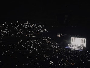 An audience enjoying a beautifully lit event.