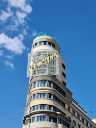 a tall building with a blue sky
