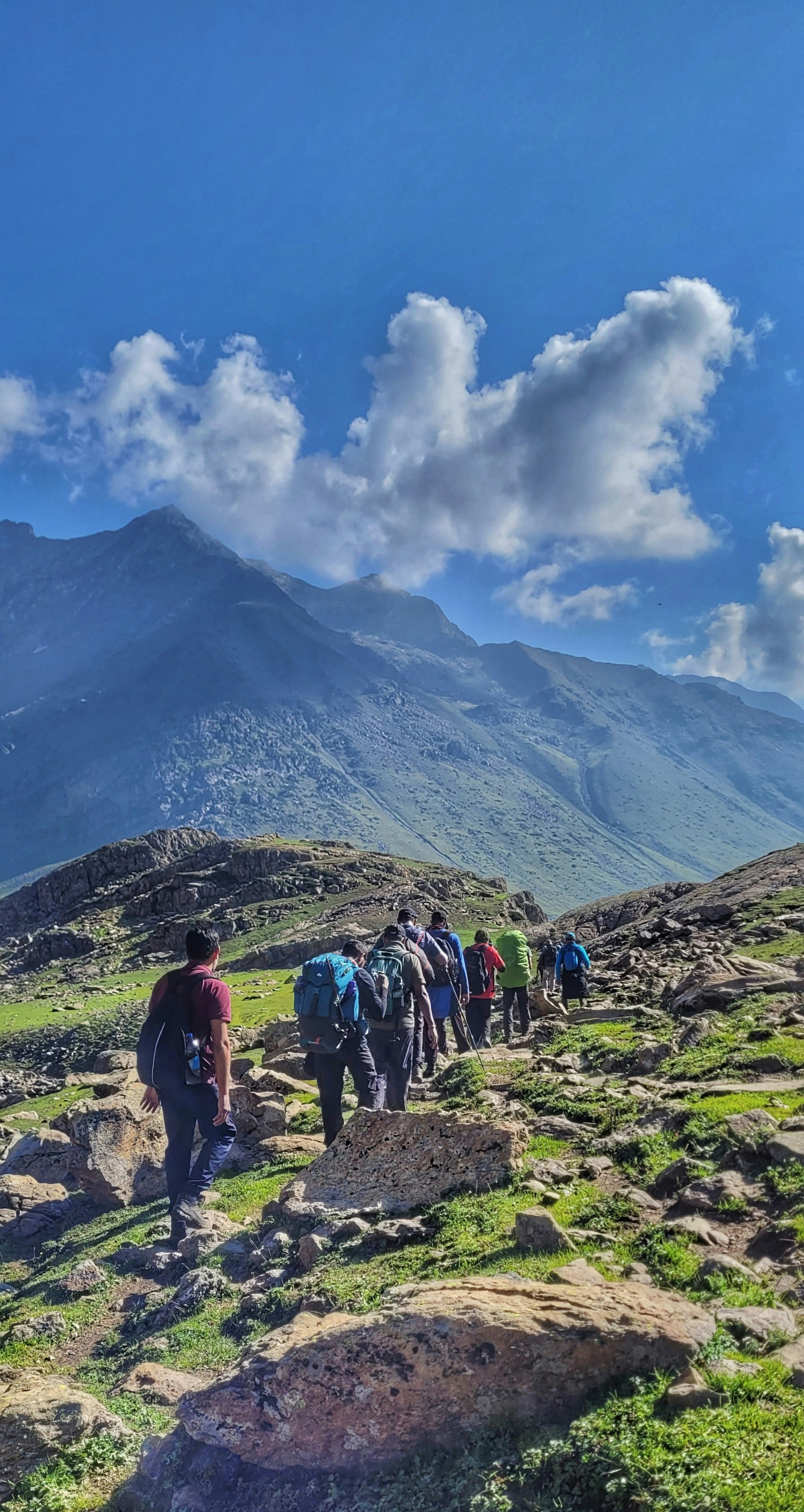 Adventure traveler performing a travel risk assessment before a mountain expedition
