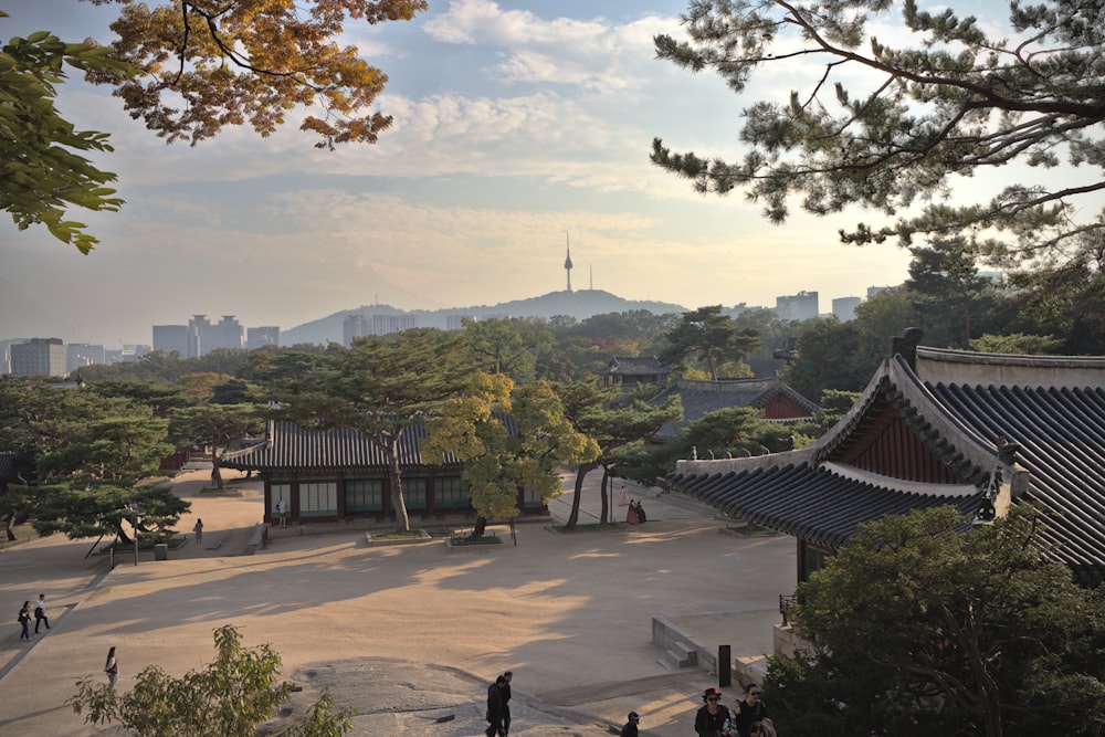 a courtyard with buildings and trees