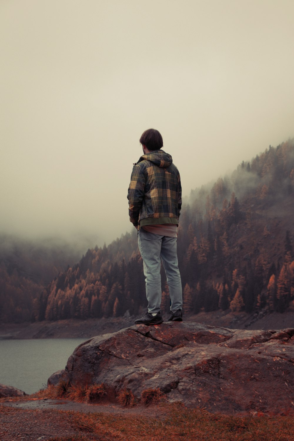 a person standing on a rock