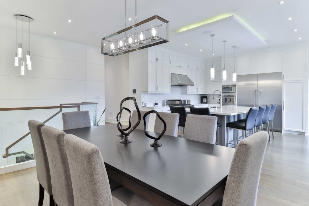 a kitchen with a dining table and chairs