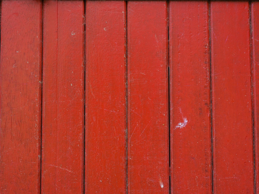 a red wall with white lines