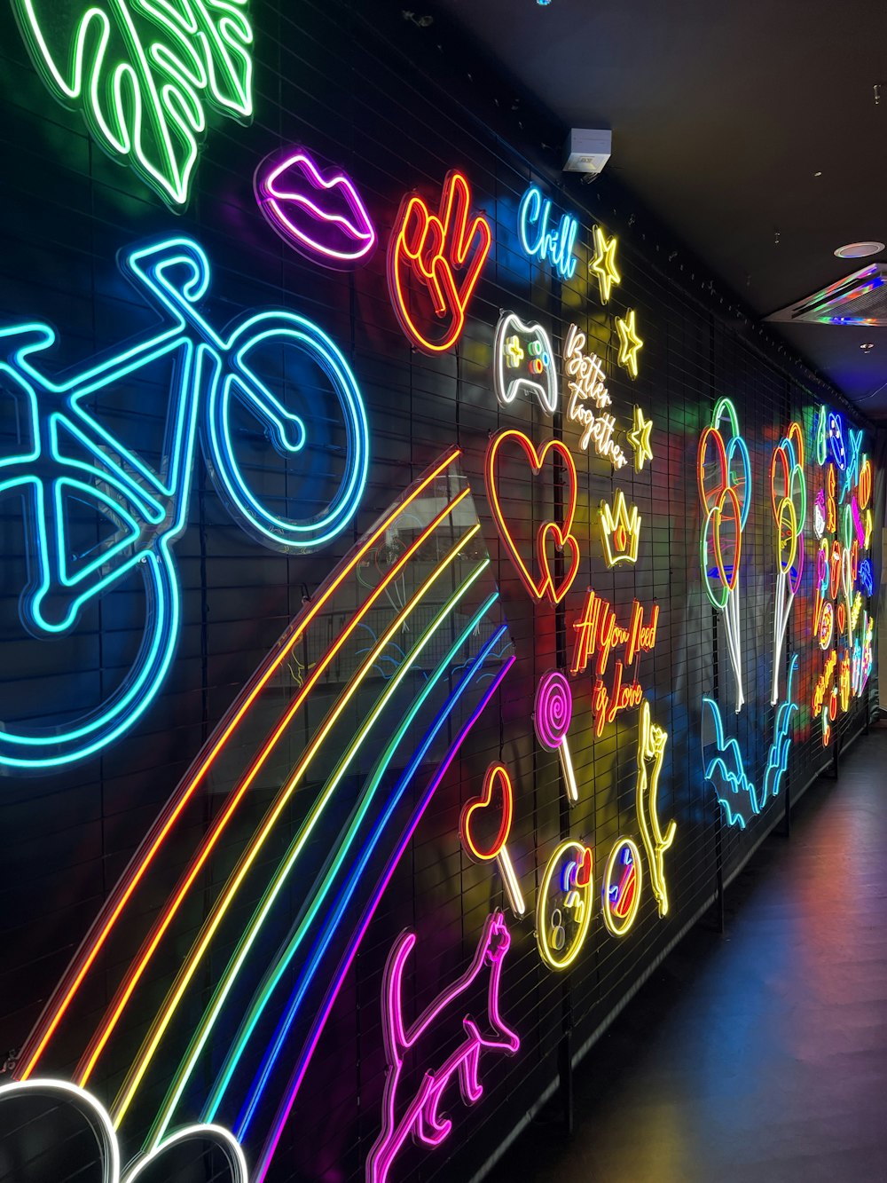 a wall with neon signs
