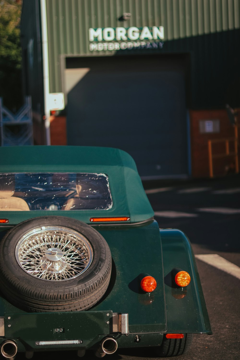 a green car with a large speaker