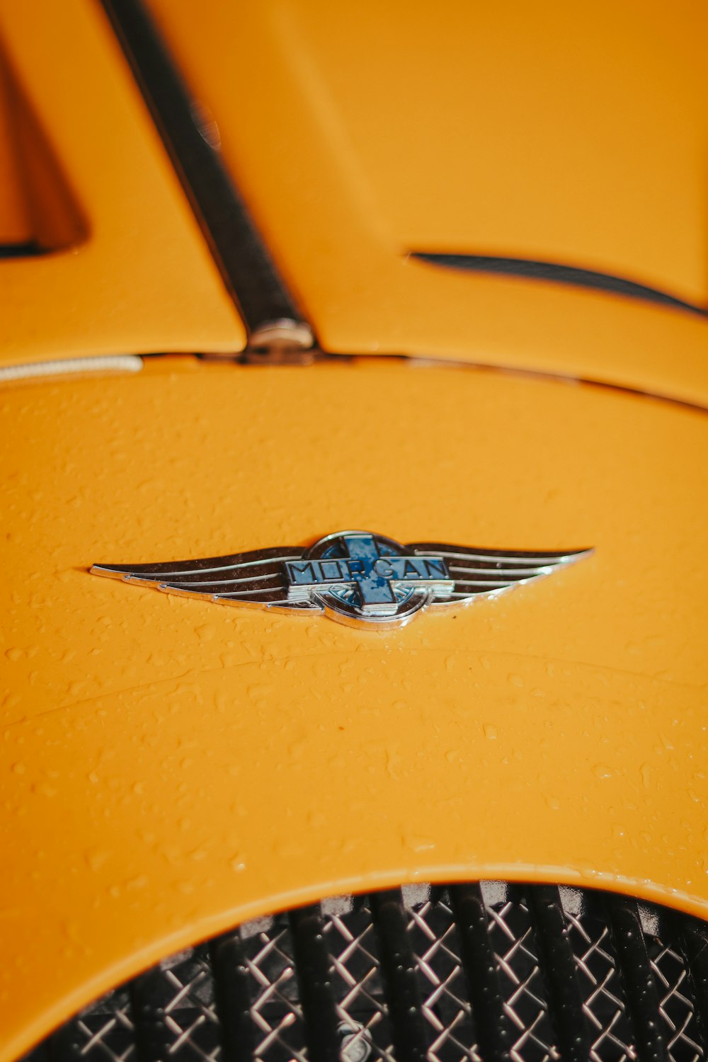 a close up of a yellow car