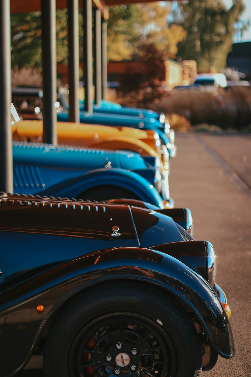 a blue car with a yellow boat on top of it