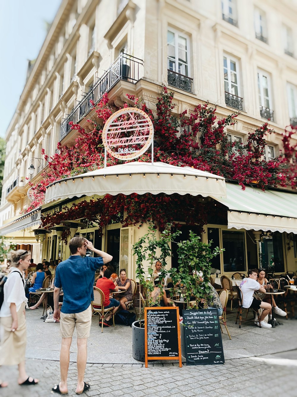 a restaurant with people sitting outside