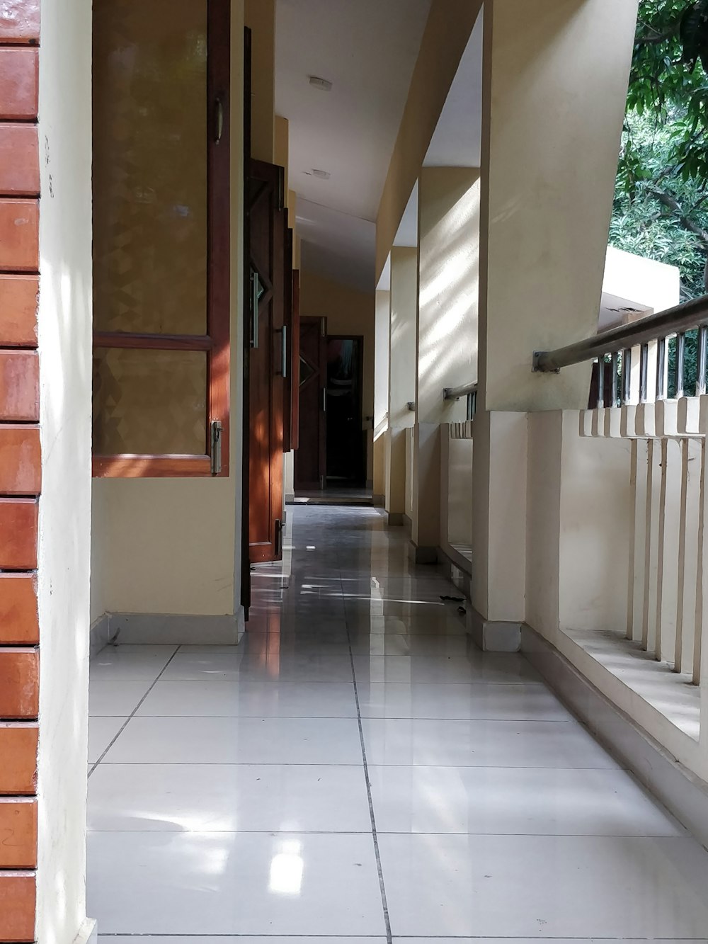 a hallway with white tile