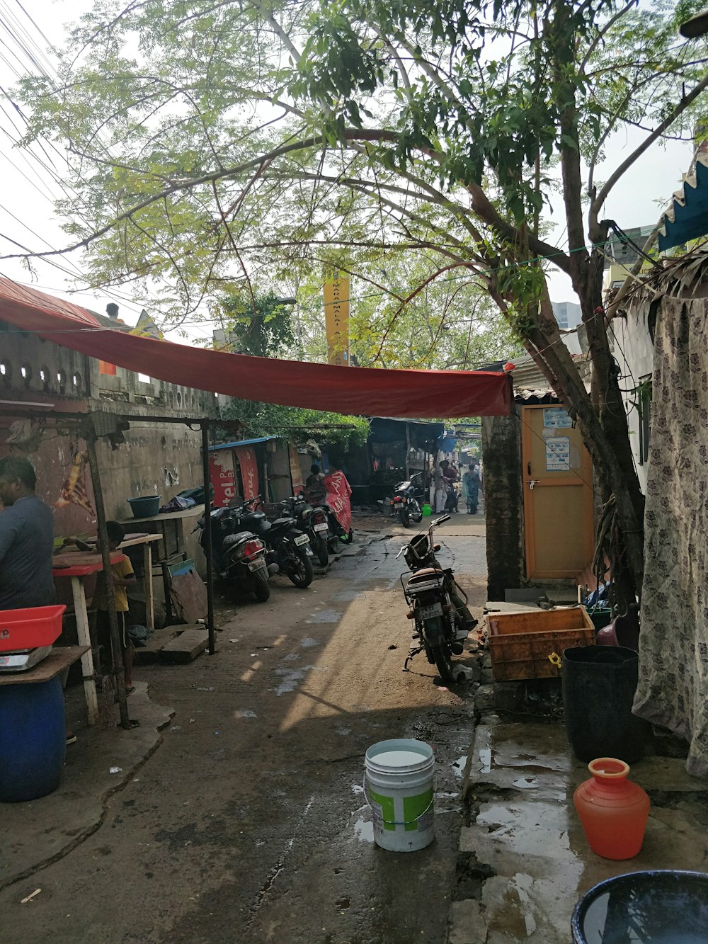 a group of motorcycles parked outside a small shop