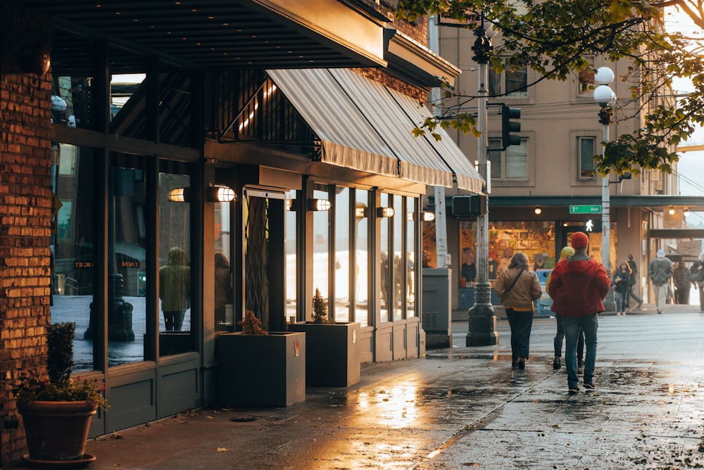 people walking on a wet street