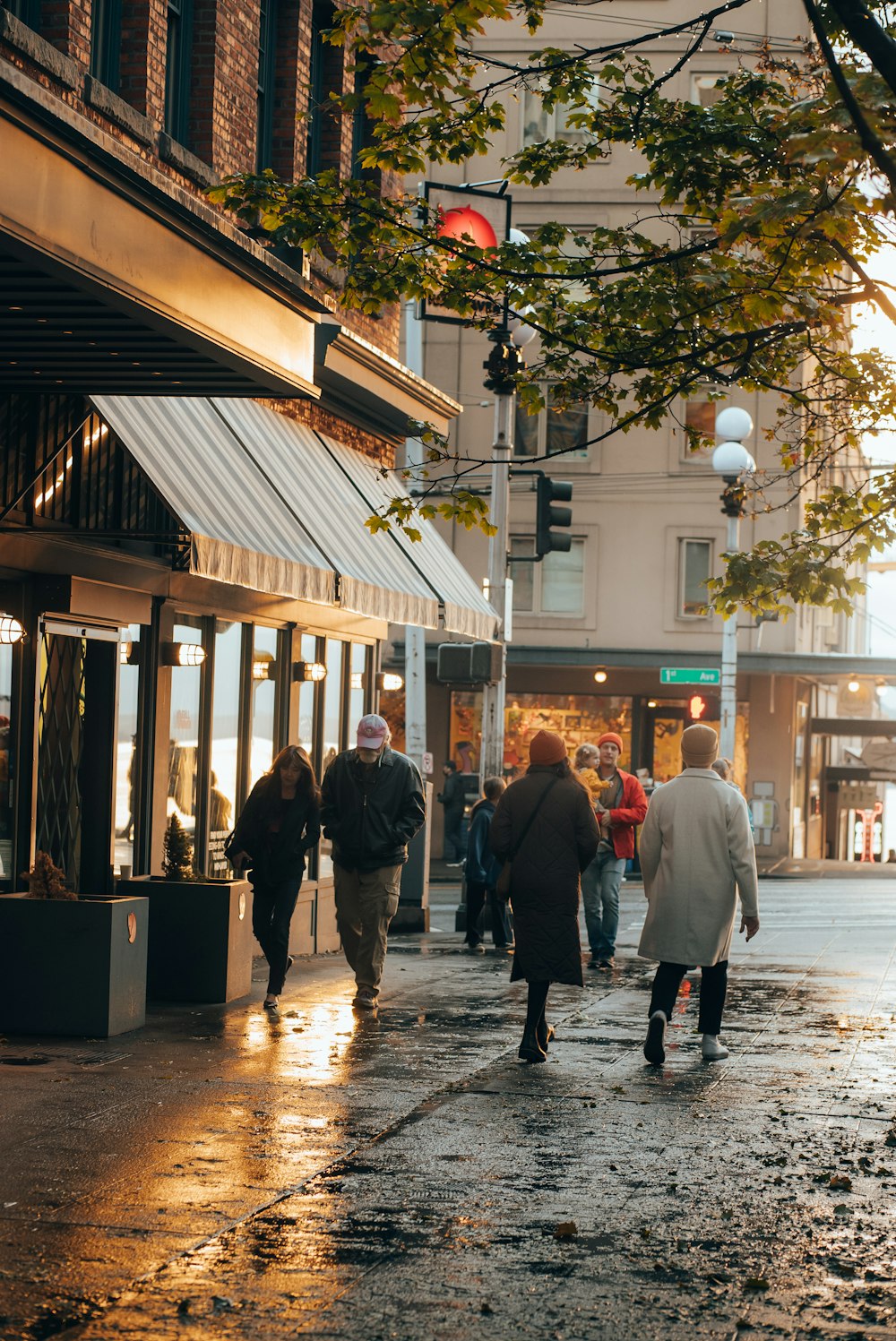 people walking on a wet street