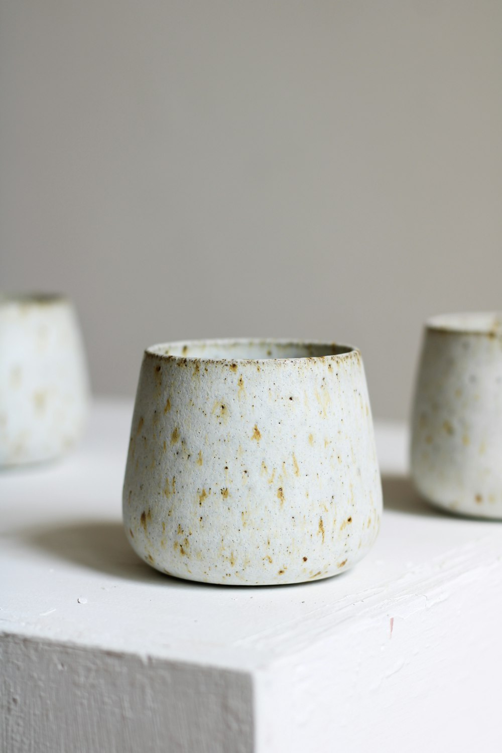 a yellow and white ceramic pot