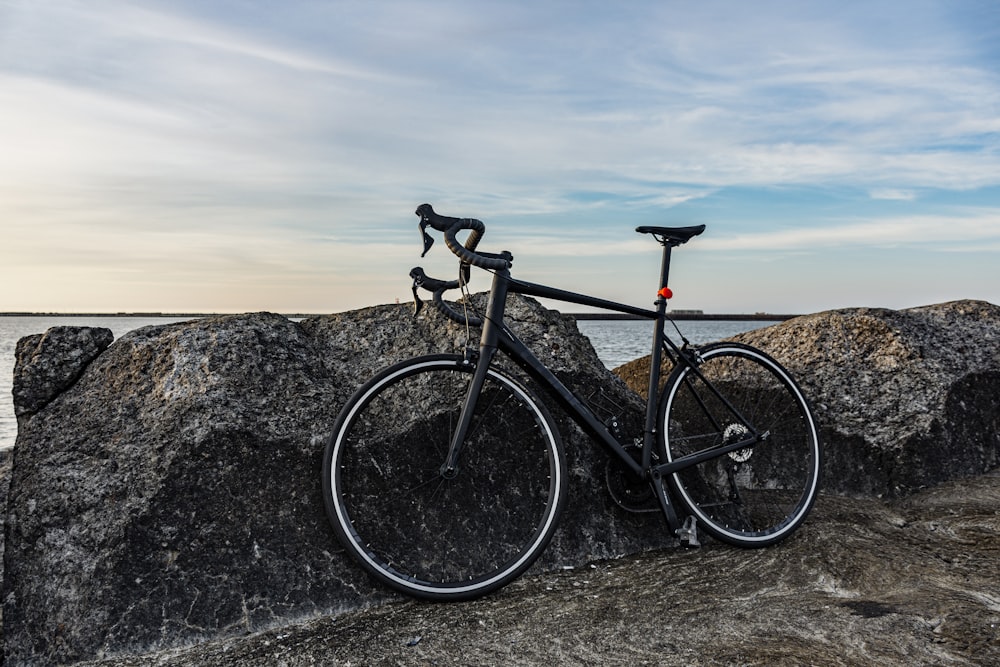 a bicycle parked on a rock