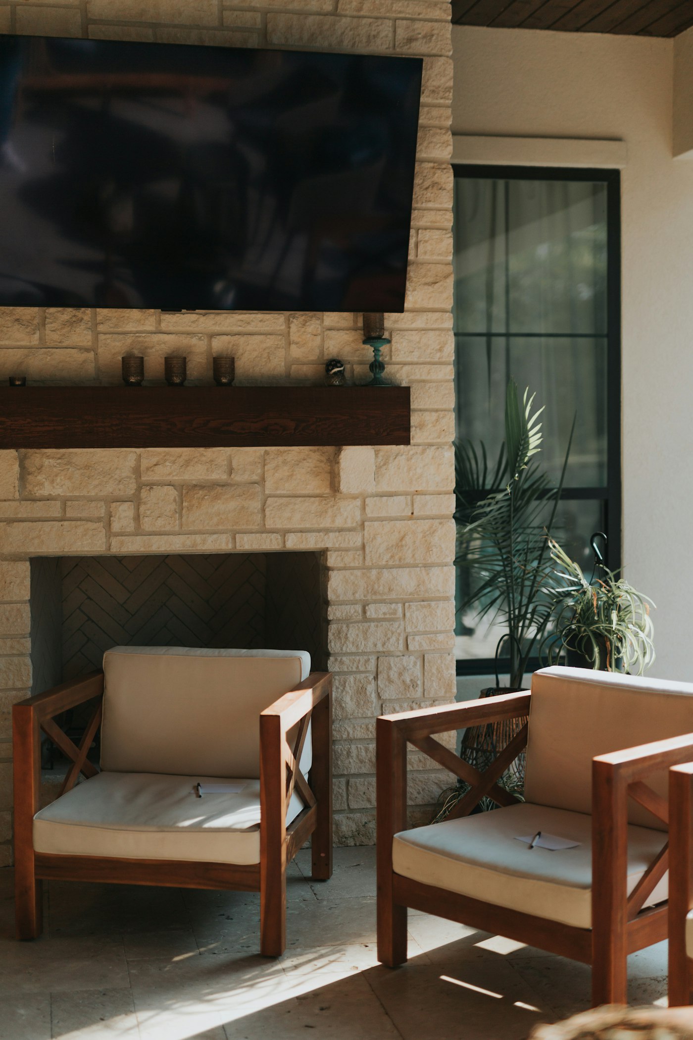 A stone fireplace on a covered patio (example photo)