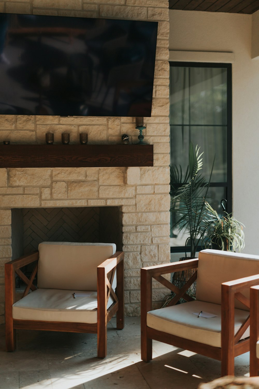 a fireplace with chairs in front of it