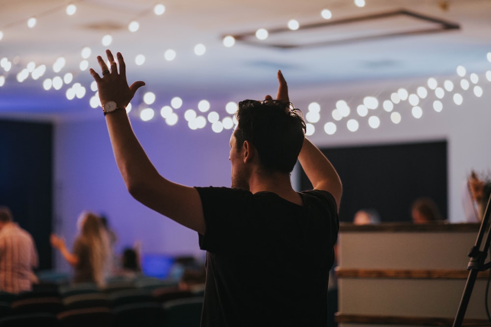 a person raising the hands