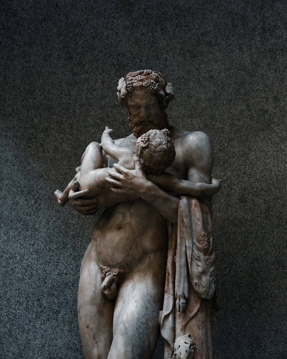 a statue of a man holding a woman