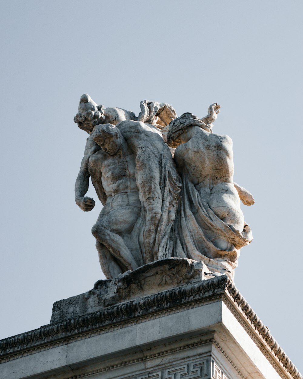 a statue of a person riding a horse