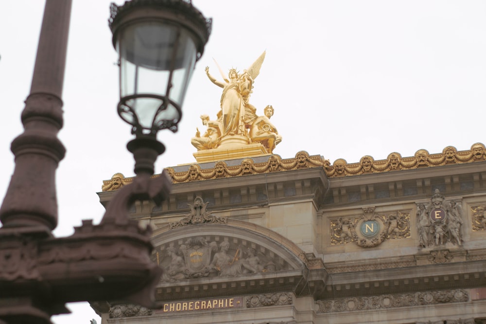 a building with a statue on top