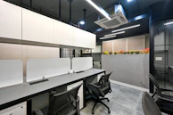 a conference room with a table and chairs