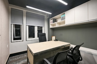 a room with a table and chairs