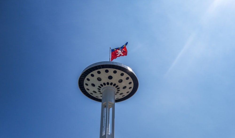 a flag flying on top of a clock tower