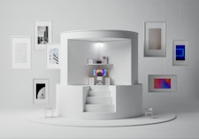 a room with a white staircase and a tv