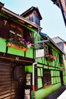 View of the charming exterior facade of the gîte, blending traditional and modern design.
