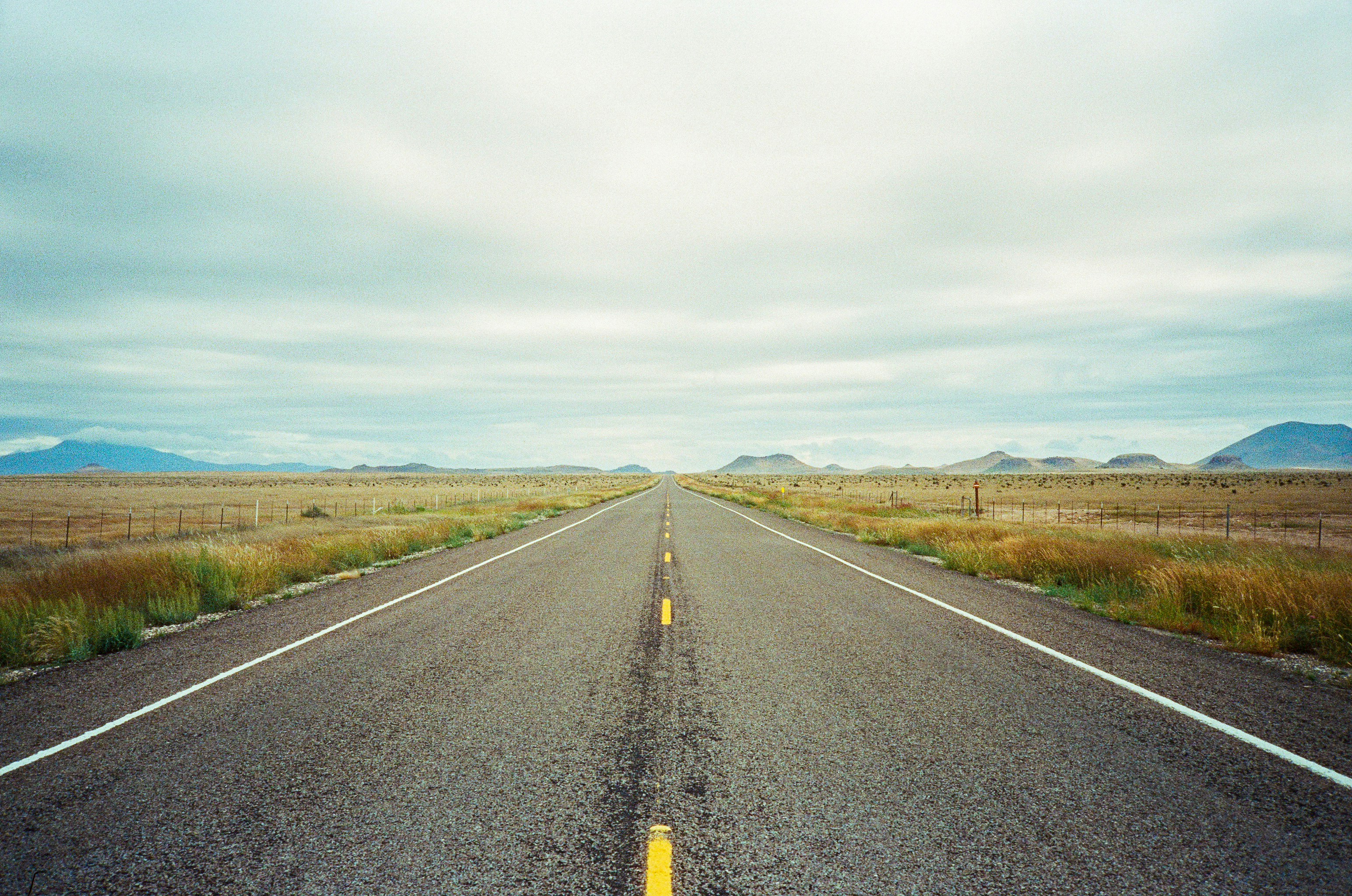 a road with grass on the side, 