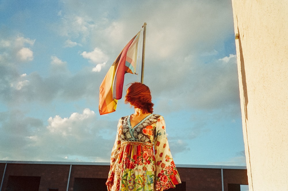 a person standing in front of a flag