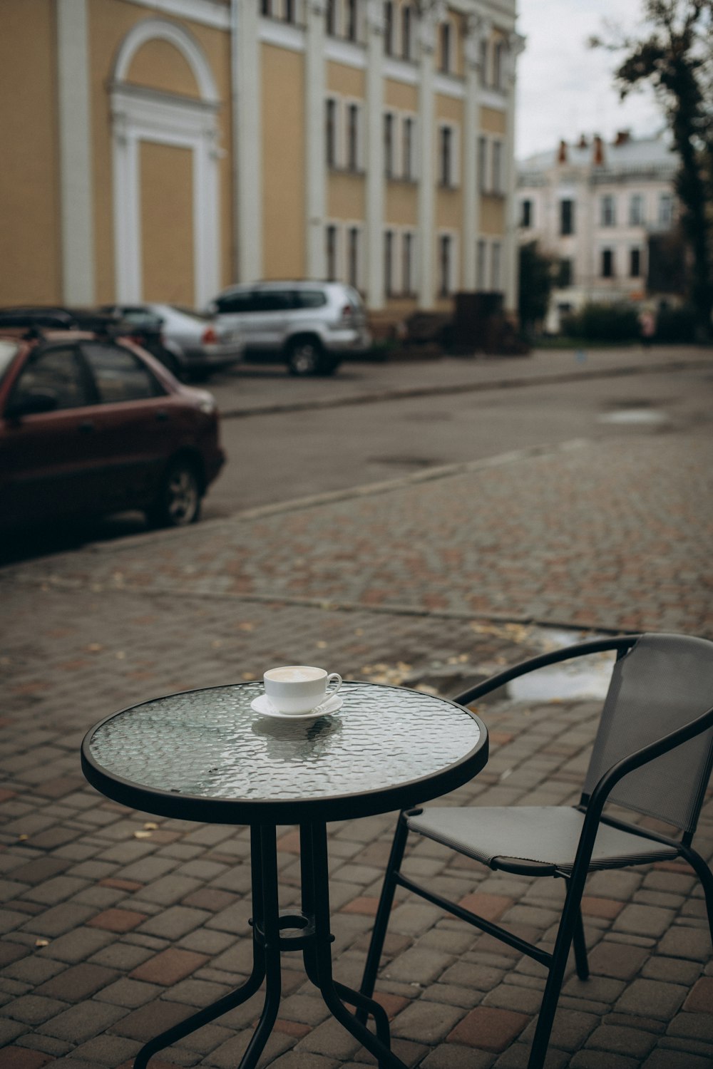 a table and chairs on a sidewalk