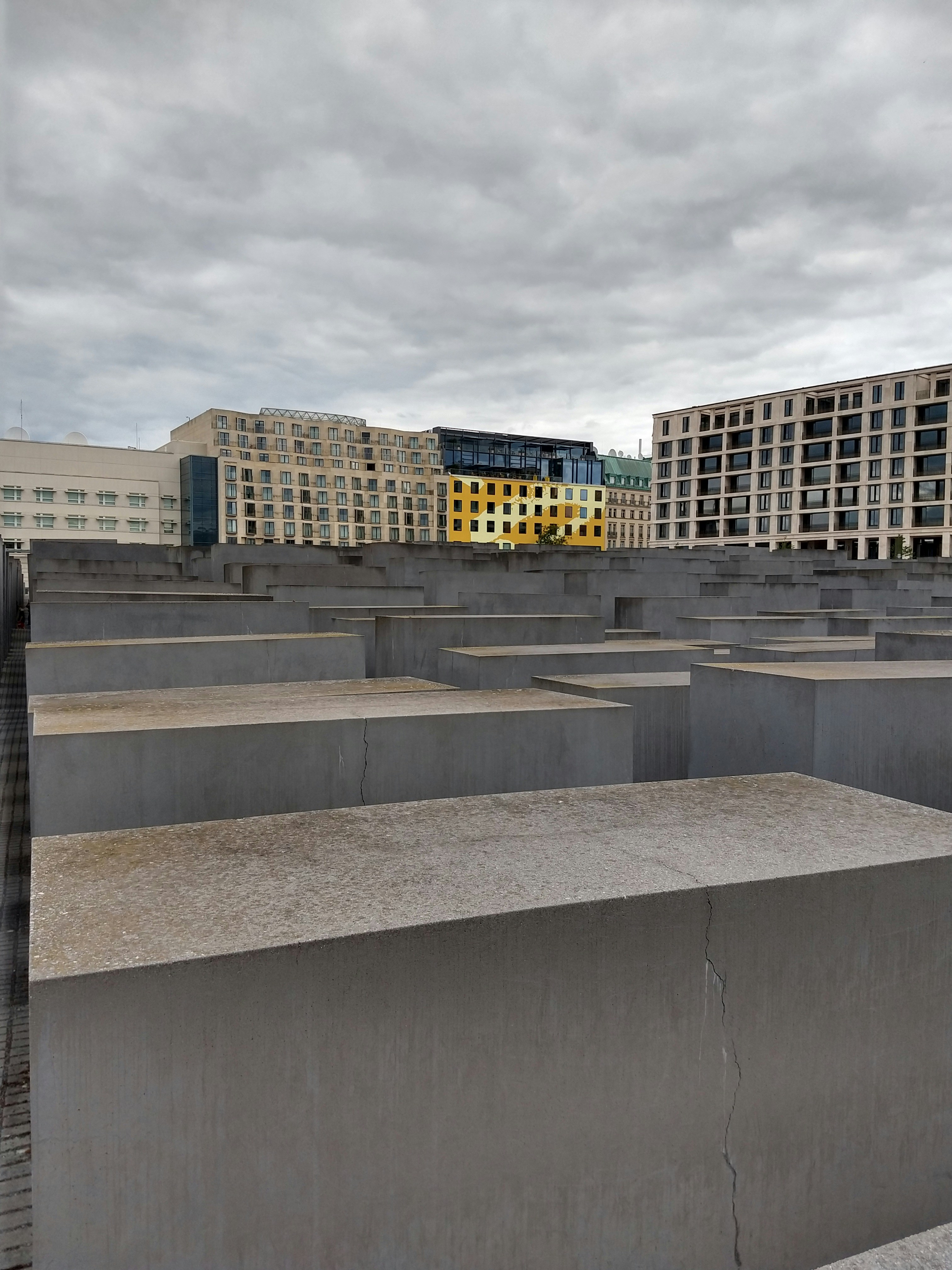 a yellow bus on a bridge